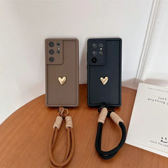 Samsung Galaxy Case with 3D Gold Heart Love Wrist Strap – For S25 Ultra, S24, S23, S22 Plus & More Models
