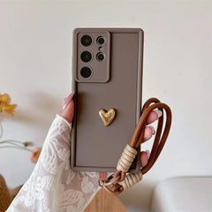 Samsung Galaxy Case with 3D Gold Heart Love Wrist Strap – For S25 Ultra, S24, S23, S22 Plus & More Models